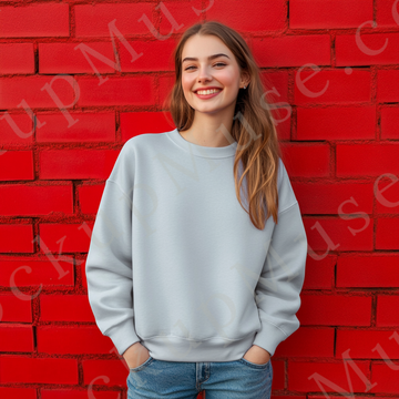 Womens grey sweatshirt mockup – lifestyle, outdoor red wall, smiling; Gildan 18000 fit