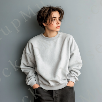Womens grey sweatshirt mockup – studio editorial, grey wall, cropped stance; Gildan 18000 fit