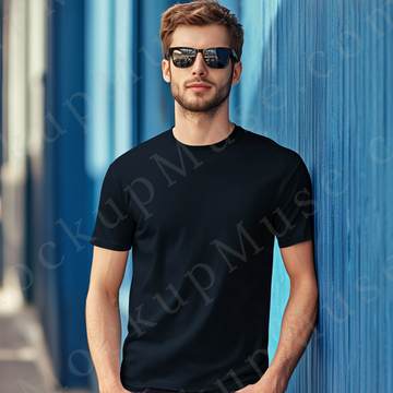 Men’s black Gildan 5000 crewneck t-shirt mockup — editorial, bold blue wall, sunglasses, front view