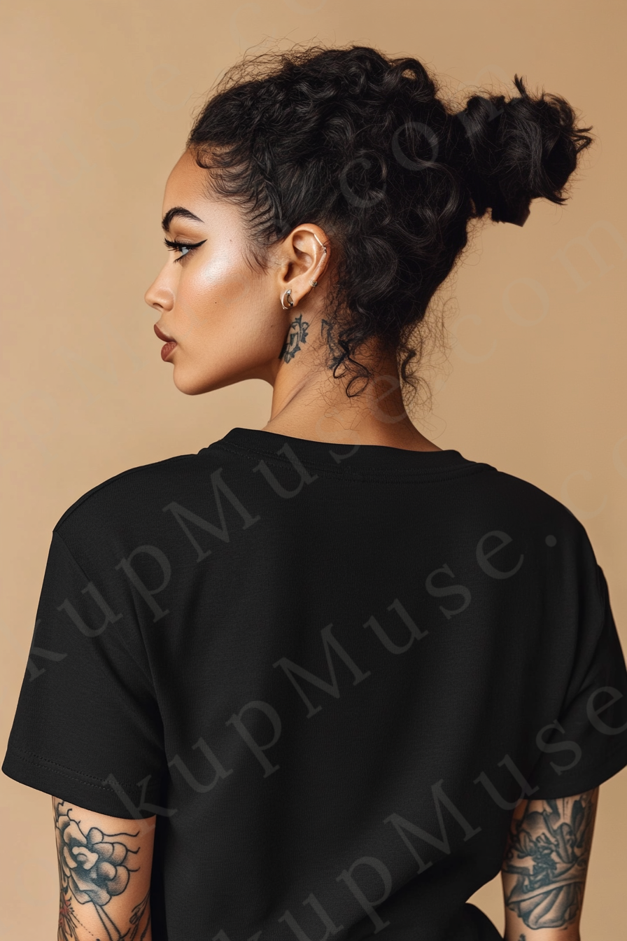 Vertical 2:3 women’s black onyx Gildan 5000 t‑shirt mockup, back view on tan studio with tattooed arms visible; clean apparel template for online stores.